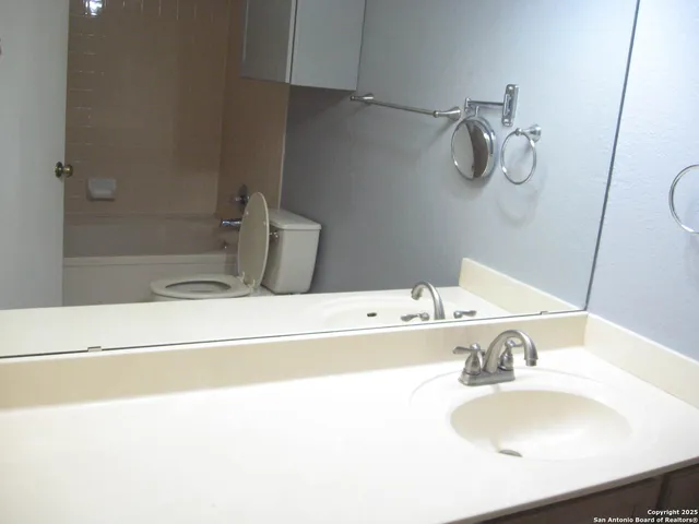 a bathroom with a sink and a bathtub