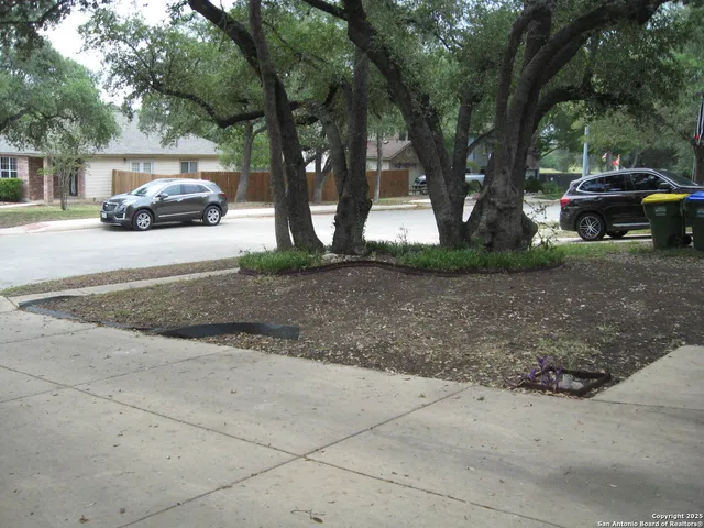 a view of a car parked on the side of a road