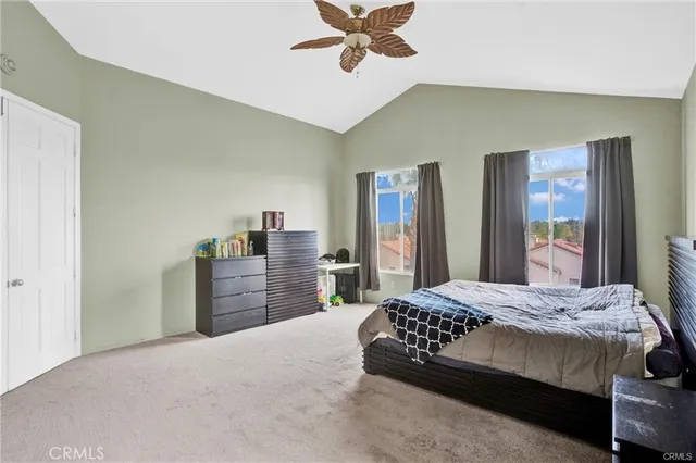 a bedroom with a bed and dresser