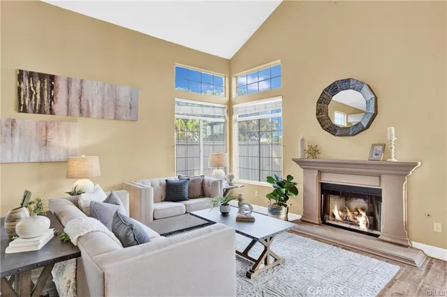 a living room with furniture and a fireplace