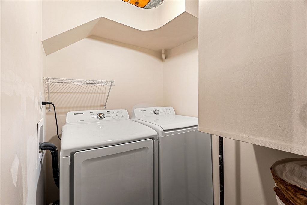 50 Rantoul Street, Unit 505 Beverly, MA 01915 - Photo 23 of 30 a utility room with dryer and washer