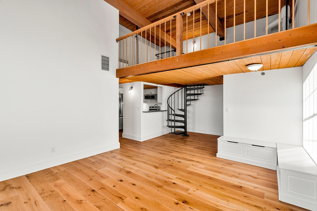 50 Rantoul Street, Unit 505 Beverly, MA 01915 - Photo 3 of 30 a view of an empty room with wooden floor