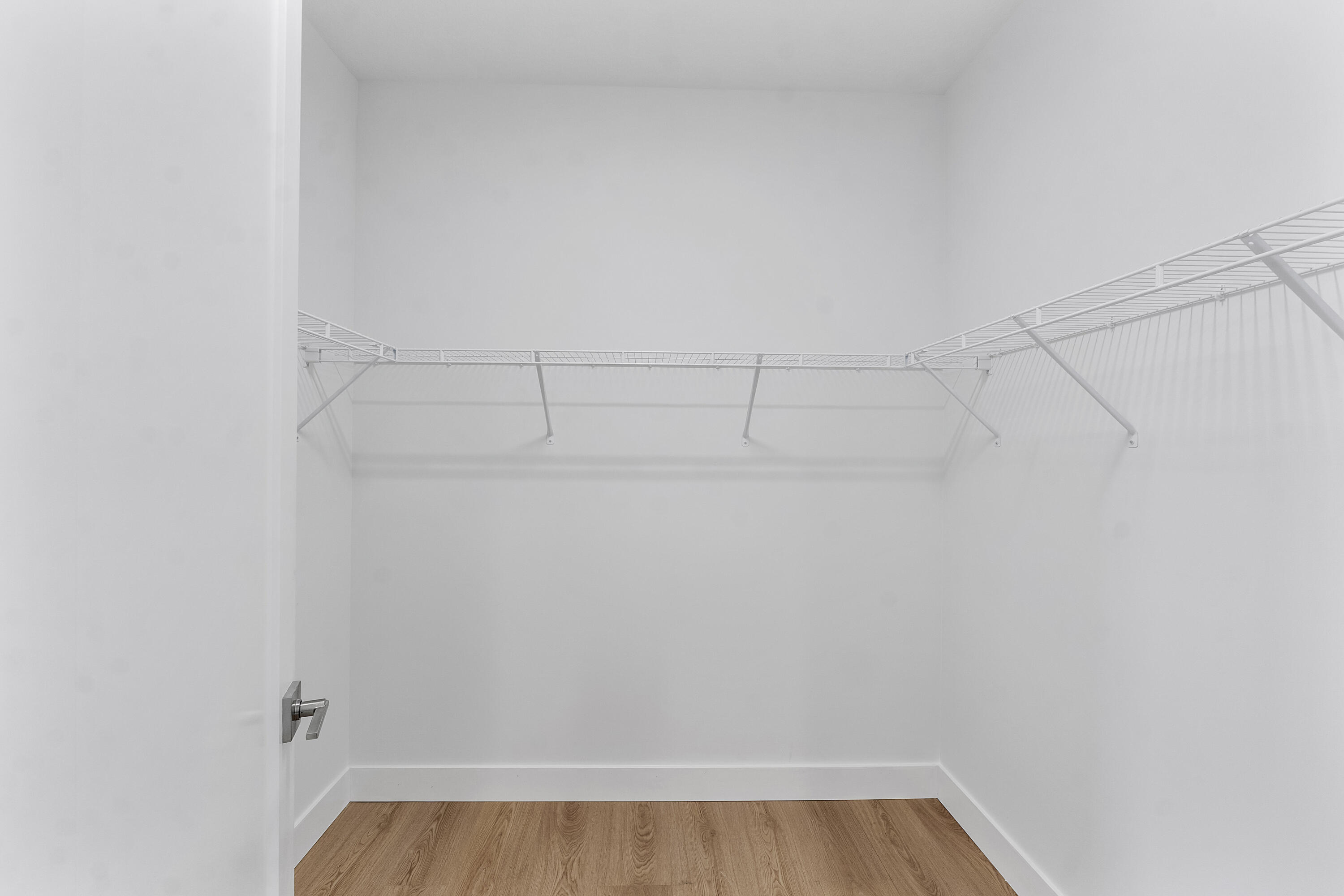 9322 Sunflower Mdw Road Boca Raton, FL 33434 - Photo 40 of 87 a view of a room with racks on the wall