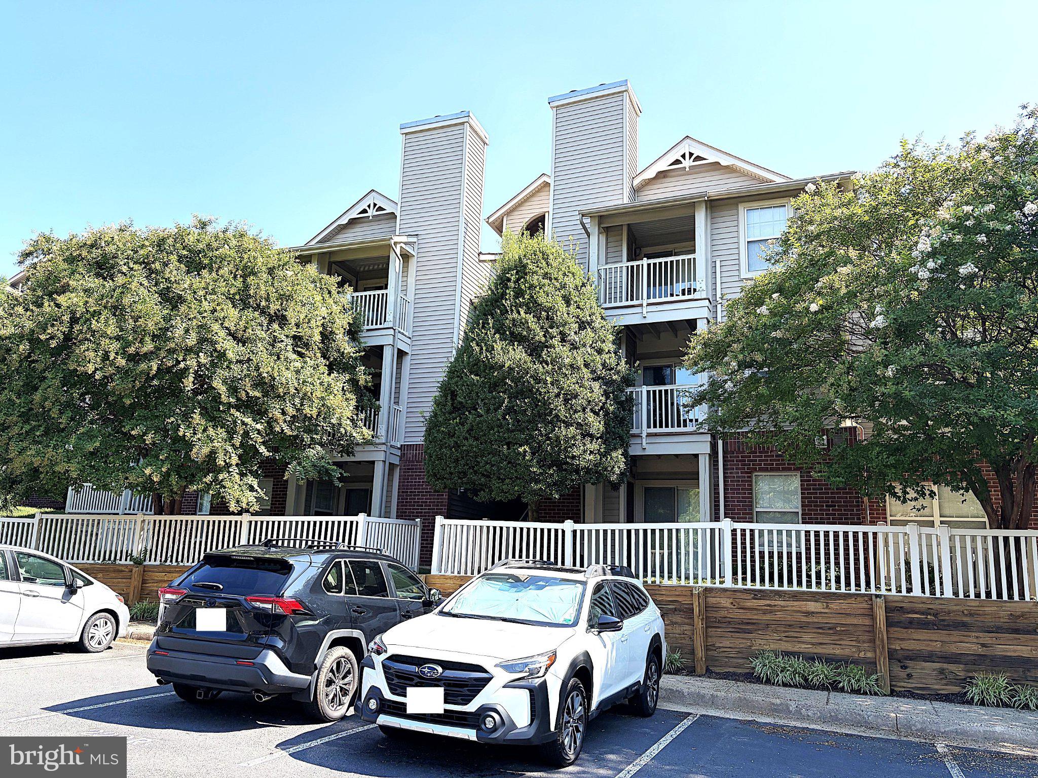 11653 Gas Light Court, Unit H Reston, VA 20190 - Photo 2 of 28 Charming apartment complex with greenery.