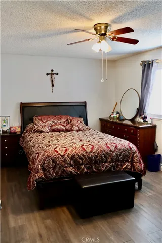 a bed sitting in a bedroom next to a dresser