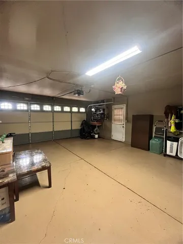 a view of a patio with table and chairs a barbeque with wooden fence