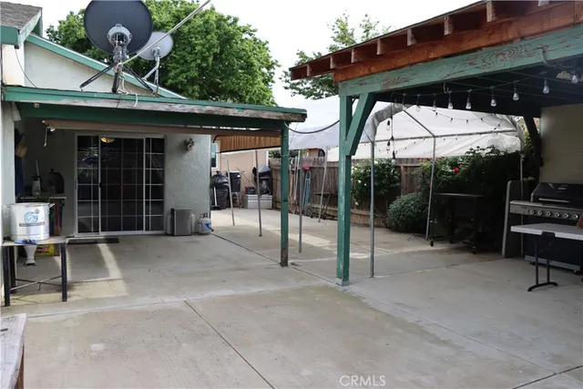 a view of a chairs and tables in patio