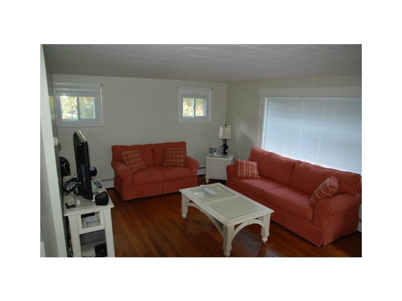490 Middlebridge Road South Kingstown, RI 02879 - Photo 12 of 18 Living Room. Living room view prior to replacing the older tile ceiling with bead board.