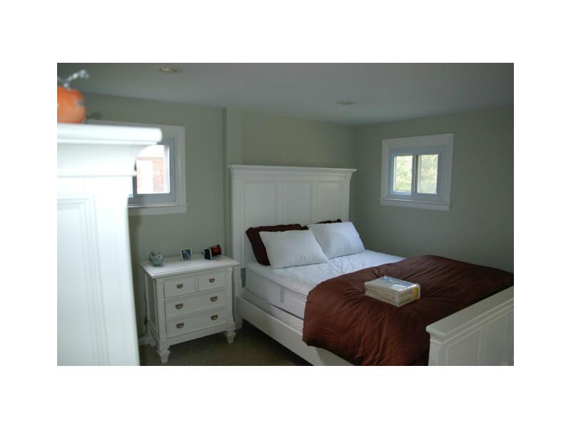 490 Middlebridge Road South Kingstown, RI 02879 - Photo 9 of 18 Master Bedroom. Notice the theme of muted colors with white trim throughout the home. Hardwood floors will be installed this week replacing th carpet flooring.
