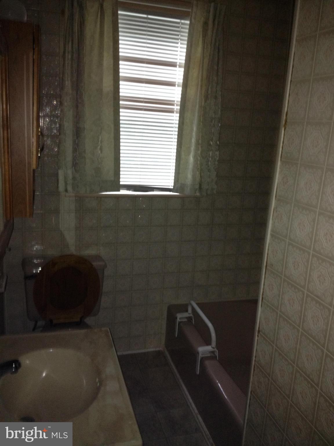 5831 Shookstown Road Frederick, MD 21702 - Photo 3 of 7 a bathroom with a toilet and a window