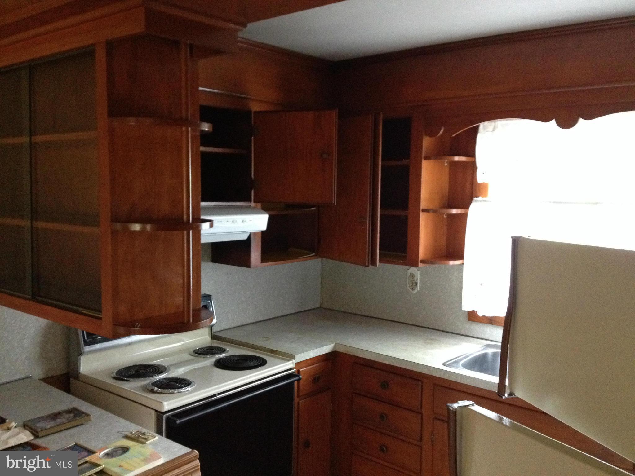 5831 Shookstown Road Frederick, MD 21702 - Photo 4 of 7 a kitchen with a cabinets and window