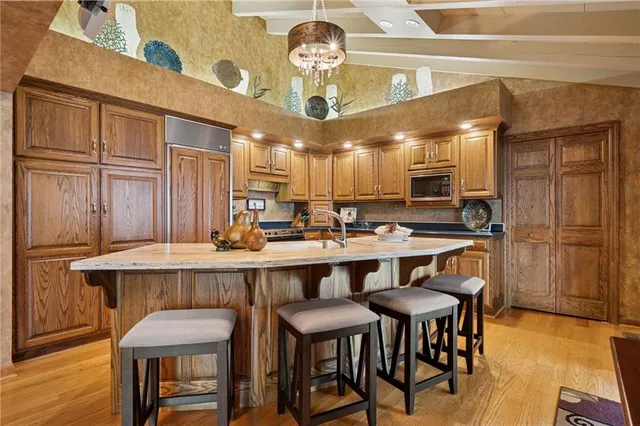 a dining table with chairs and wooden floor