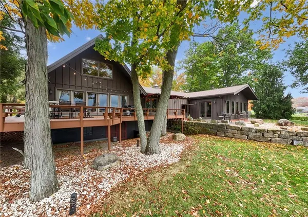 a view of house with a yard