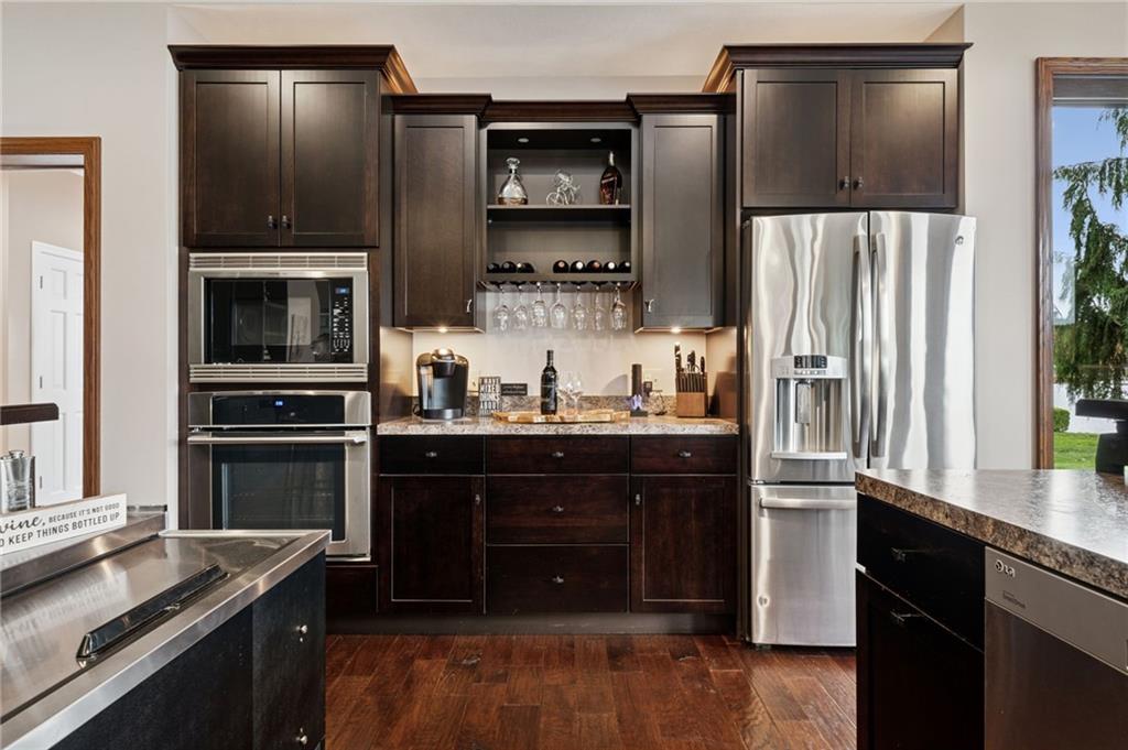 288 Latonka Drive Mercer, PA 16137 - Photo 23 of 42 a kitchen with granite countertop a refrigerator stove and microwave