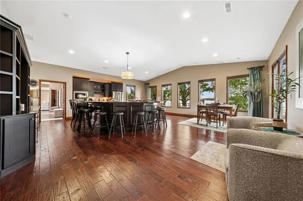 a view of a dining room with furniture window and wooden floor