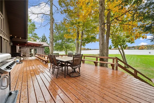 a view of a patio with swimming pool and sitting space