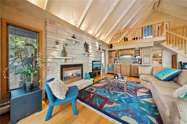 a balcony with furniture and a fireplace