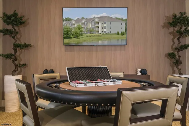 a view of a dining room with furniture and a table