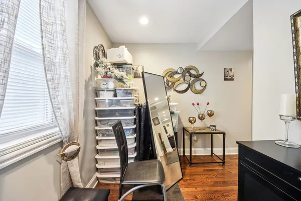 a view of a dining room with furniture and wooden floor