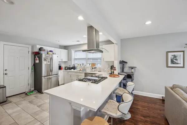 a kitchen with a table and chairs