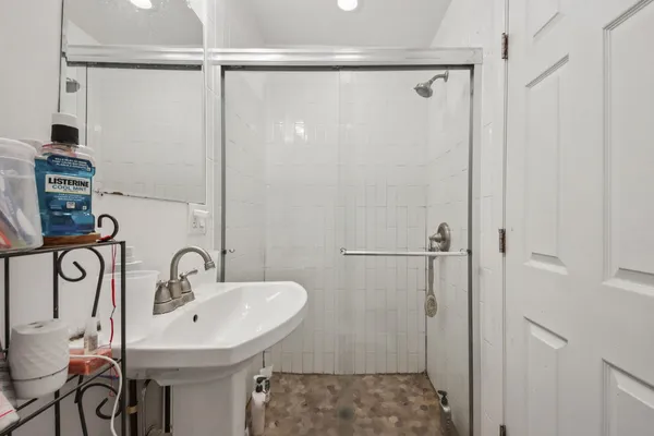 a bathroom with a sink and mirror