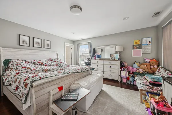 a bed room with a bed and a furniture