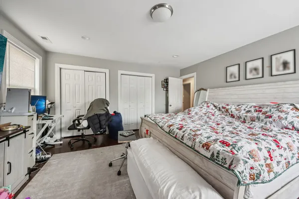 a bedroom with a bed and a couch