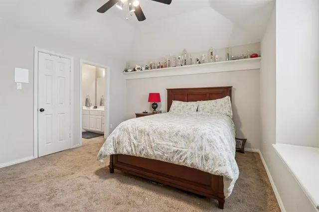a spacious bedroom with a bed and cabinets