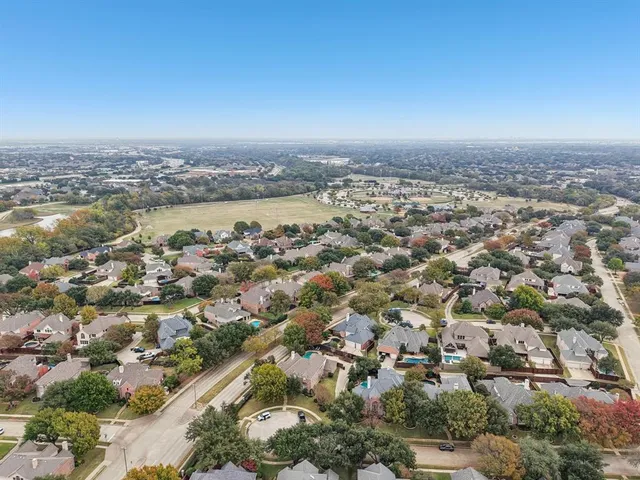 an aerial view of a city with lots of residential buildings