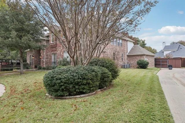 a view of a garden with a house