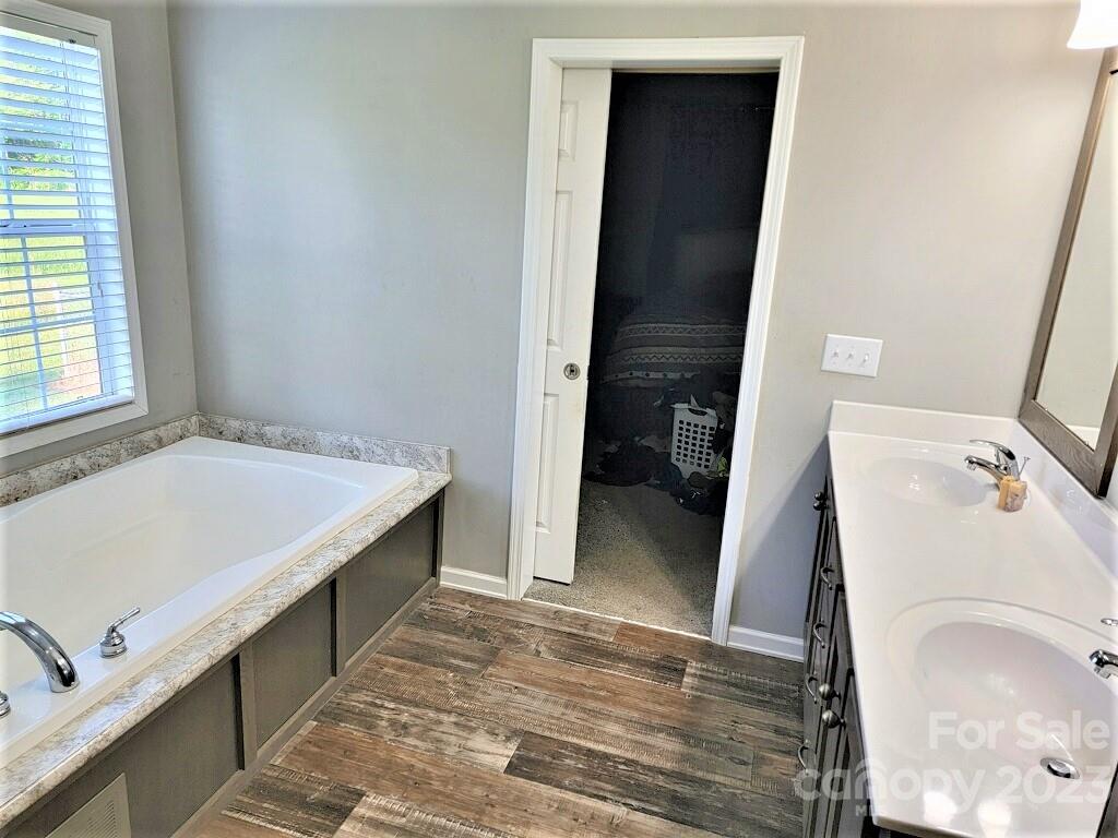 3230 Sorrells Baxter Road Cherryville, NC 28021 - Photo 12 of 29 a bathroom with a sink and a washing machine