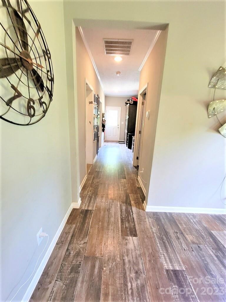 3230 Sorrells Baxter Road Cherryville, NC 28021 - Photo 16 of 29 a view of a hallway with wooden floor