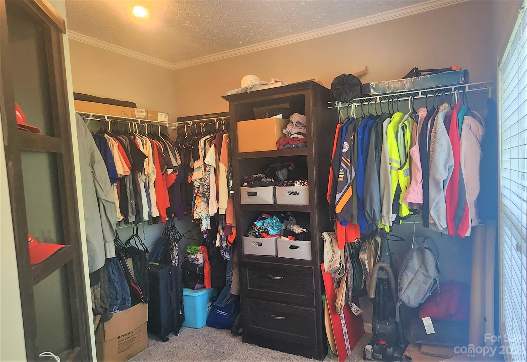 3230 Sorrells Baxter Road Cherryville, NC 28021 - Photo 19 of 29 a view of walk in closet with clothes