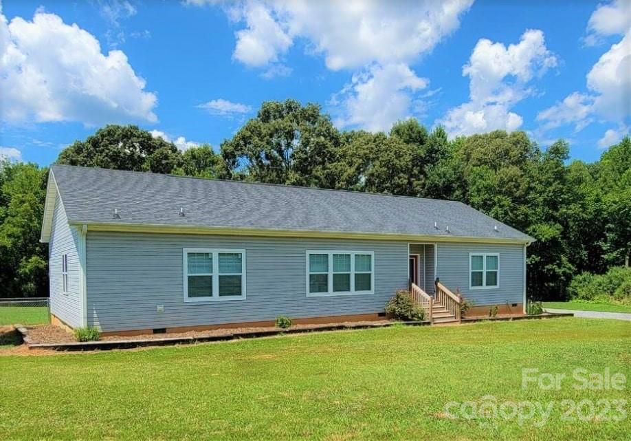 3230 Sorrells Baxter Road Cherryville, NC 28021 - Photo 2 of 29 a front view of a house with a garden