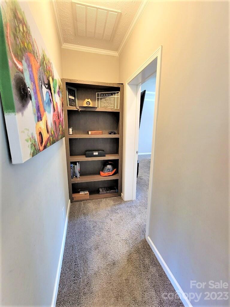 3230 Sorrells Baxter Road Cherryville, NC 28021 - Photo 24 of 29 a view of walk in closet with clothes and shoes