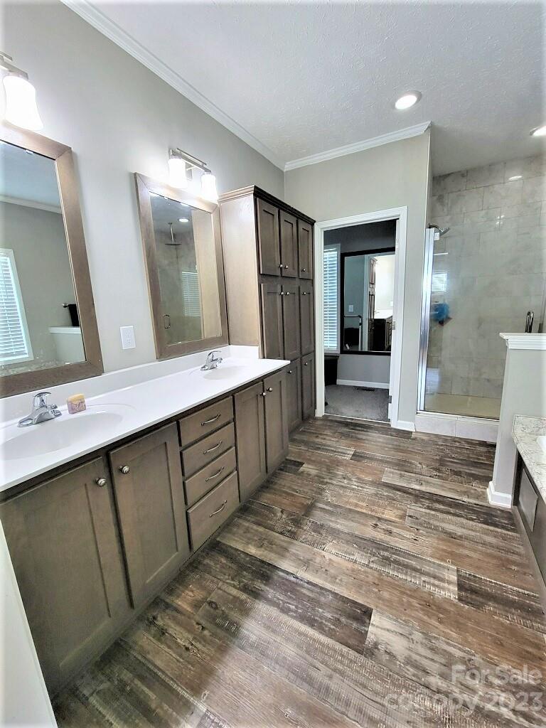 3230 Sorrells Baxter Road Cherryville, NC 28021 - Photo 25 of 29 a bathroom with a double vanity sink and a mirror