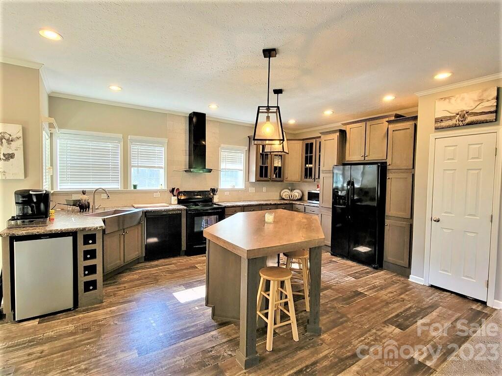 3230 Sorrells Baxter Road Cherryville, NC 28021 - Photo 5 of 29 a kitchen with stainless steel appliances granite countertop a sink stove and refrigerator