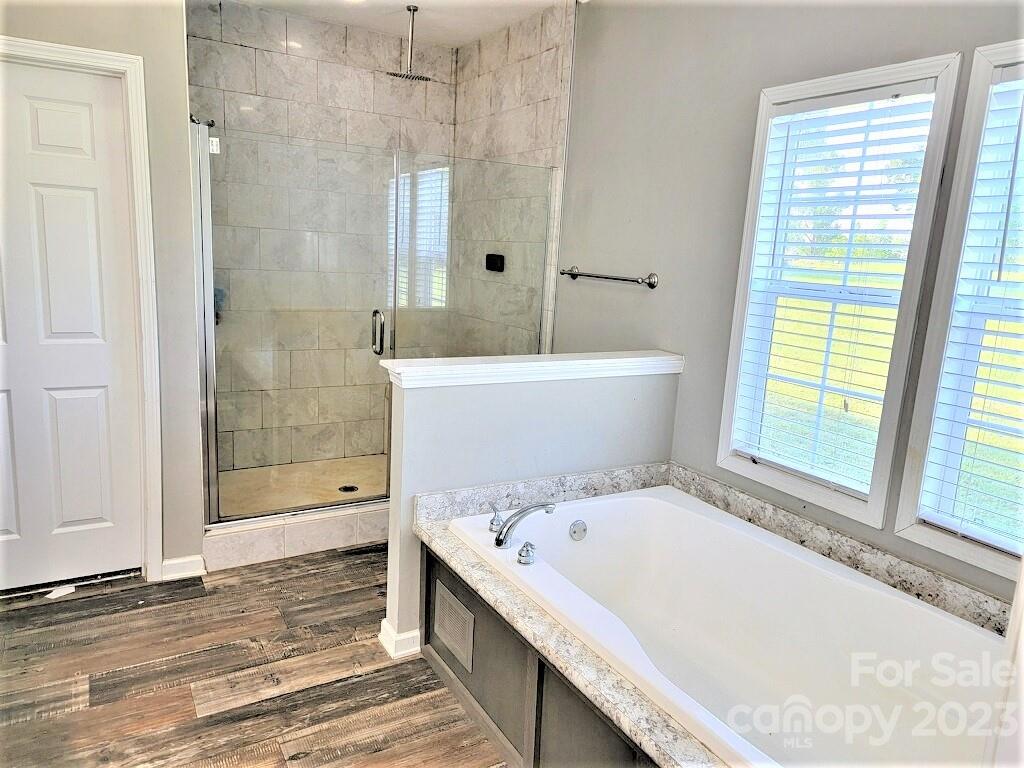 3230 Sorrells Baxter Road Cherryville, NC 28021 - Photo 7 of 29 a bathroom with a bathtub and a shower