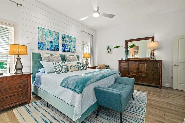 a bedroom with a bed and dresser