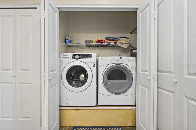 a utility room with dryer and washer