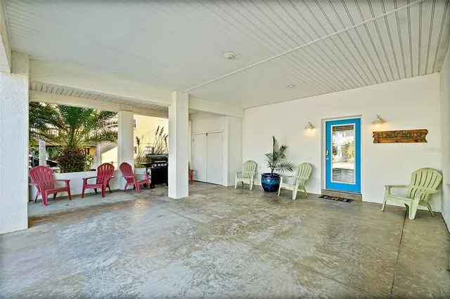 a view of living room with furniture and floor to ceiling window