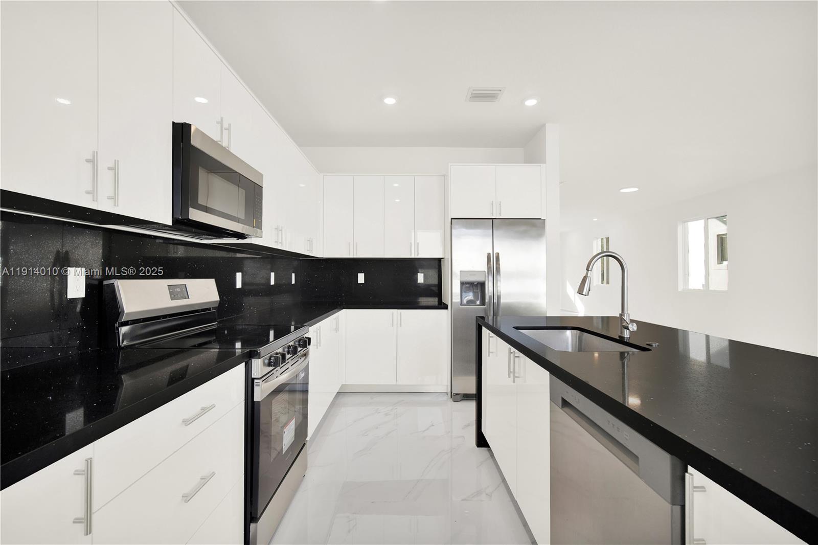 22535 Southwest 125th Avenue, Unit 22535 Miami, FL 33170 - Photo 15 of 35 a kitchen with a sink and stainless steel appliances