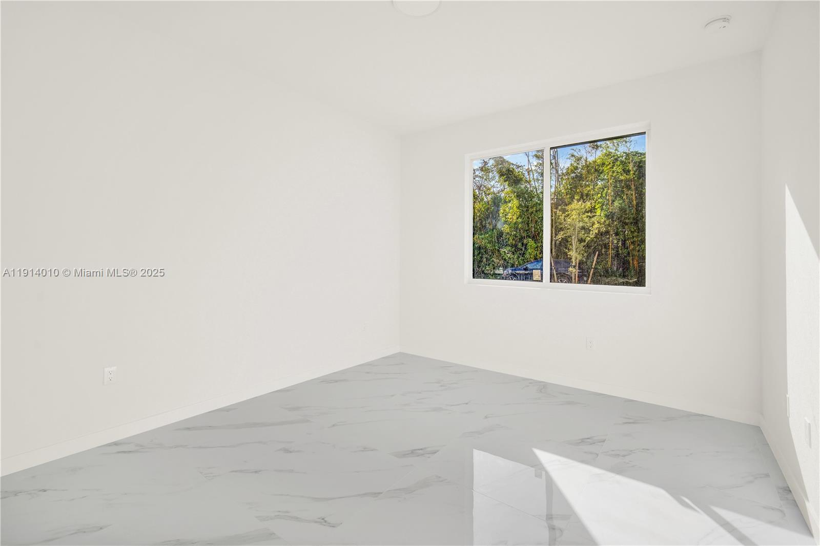 22535 Southwest 125th Avenue, Unit 22535 Miami, FL 33170 - Photo 17 of 35 a view of a small space with wooden floor and a window