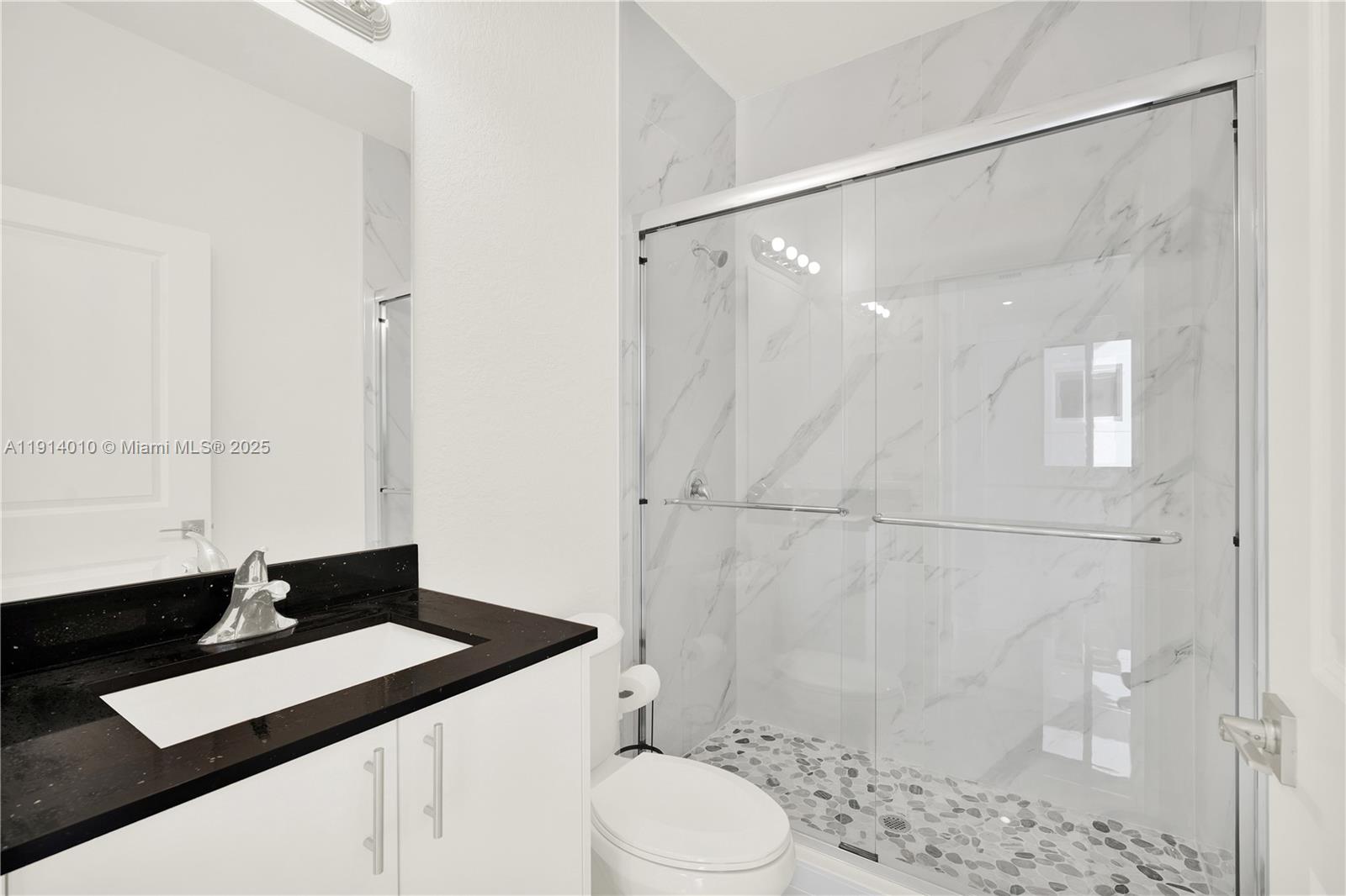 22535 Southwest 125th Avenue, Unit 22535 Miami, FL 33170 - Photo 18 of 35 a bathroom with a sink and a mirror