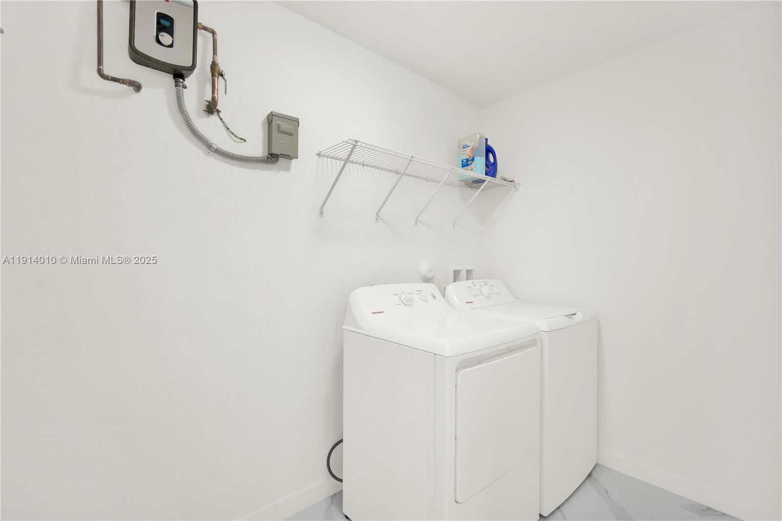 22535 Southwest 125th Avenue, Unit 22535 Miami, FL 33170 - Photo 19 of 35 a utility room with dryer and washer