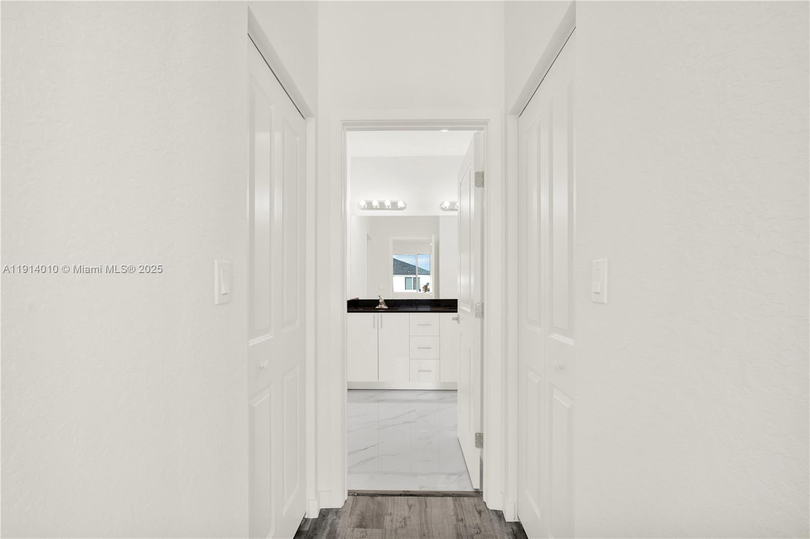 22535 Southwest 125th Avenue, Unit 22535 Miami, FL 33170 - Photo 24 of 35 a view of a hallway with wooden floor