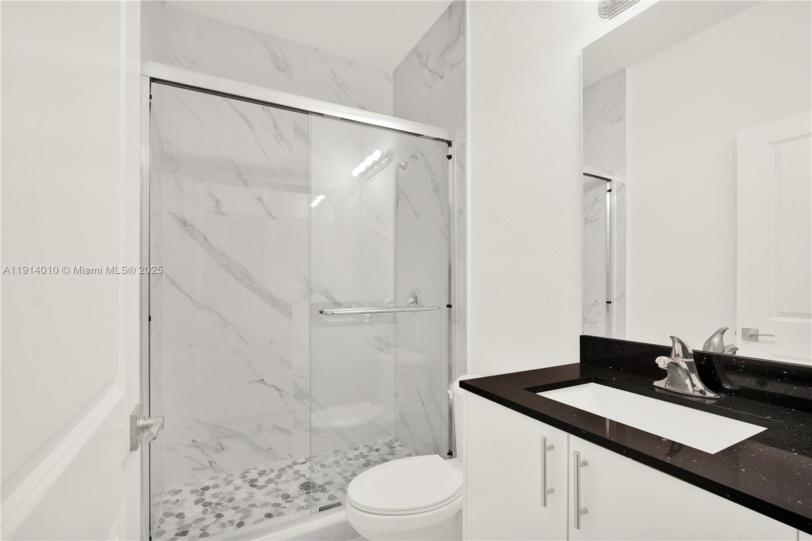 22535 Southwest 125th Avenue, Unit 22535 Miami, FL 33170 - Photo 29 of 35 a bathroom with a sink a toilet and shower