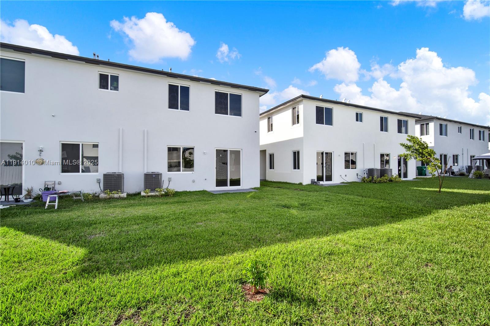 22535 Southwest 125th Avenue, Unit 22535 Miami, FL 33170 - Photo 3 of 35 a view of a white house with yard