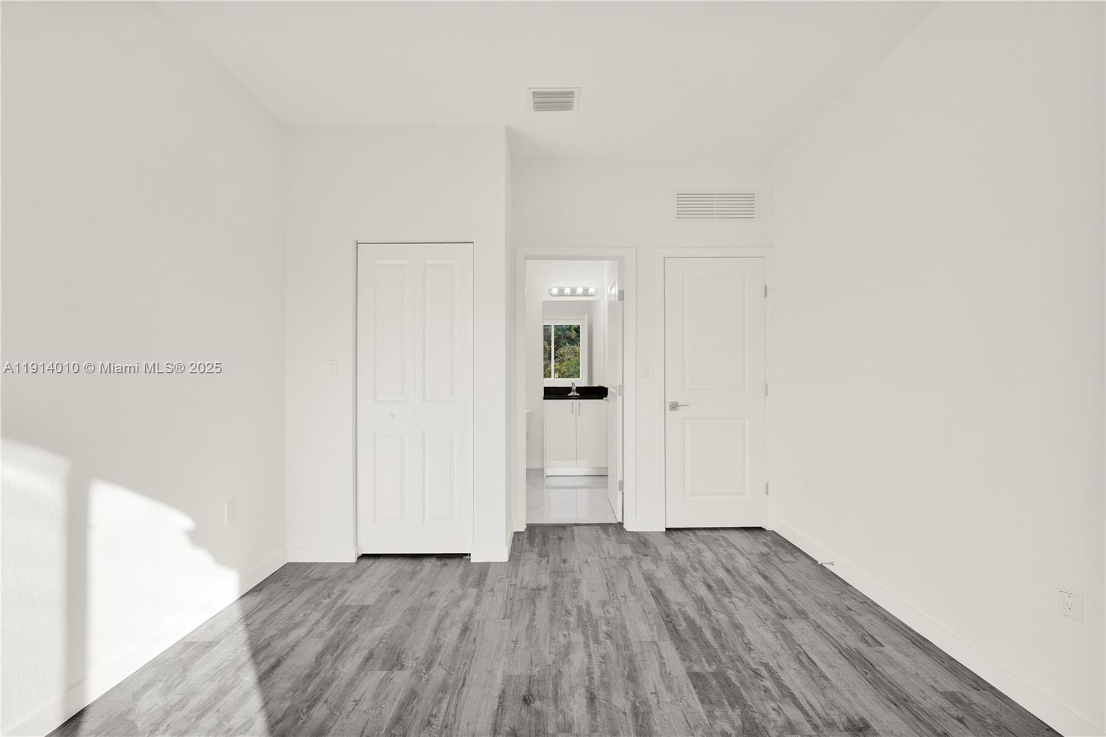 22535 Southwest 125th Avenue, Unit 22535 Miami, FL 33170 - Photo 31 of 35 a view of a hallway with wooden floor