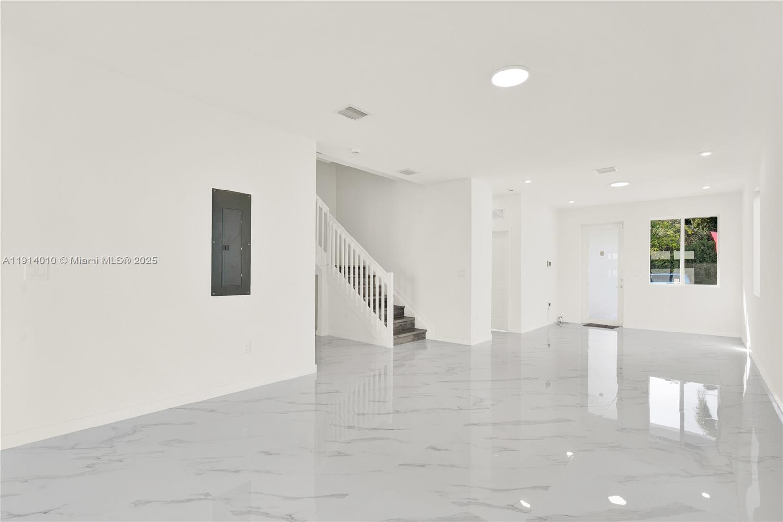 22535 Southwest 125th Avenue, Unit 22535 Miami, FL 33170 - Photo 9 of 35 a view of an empty room with stairs